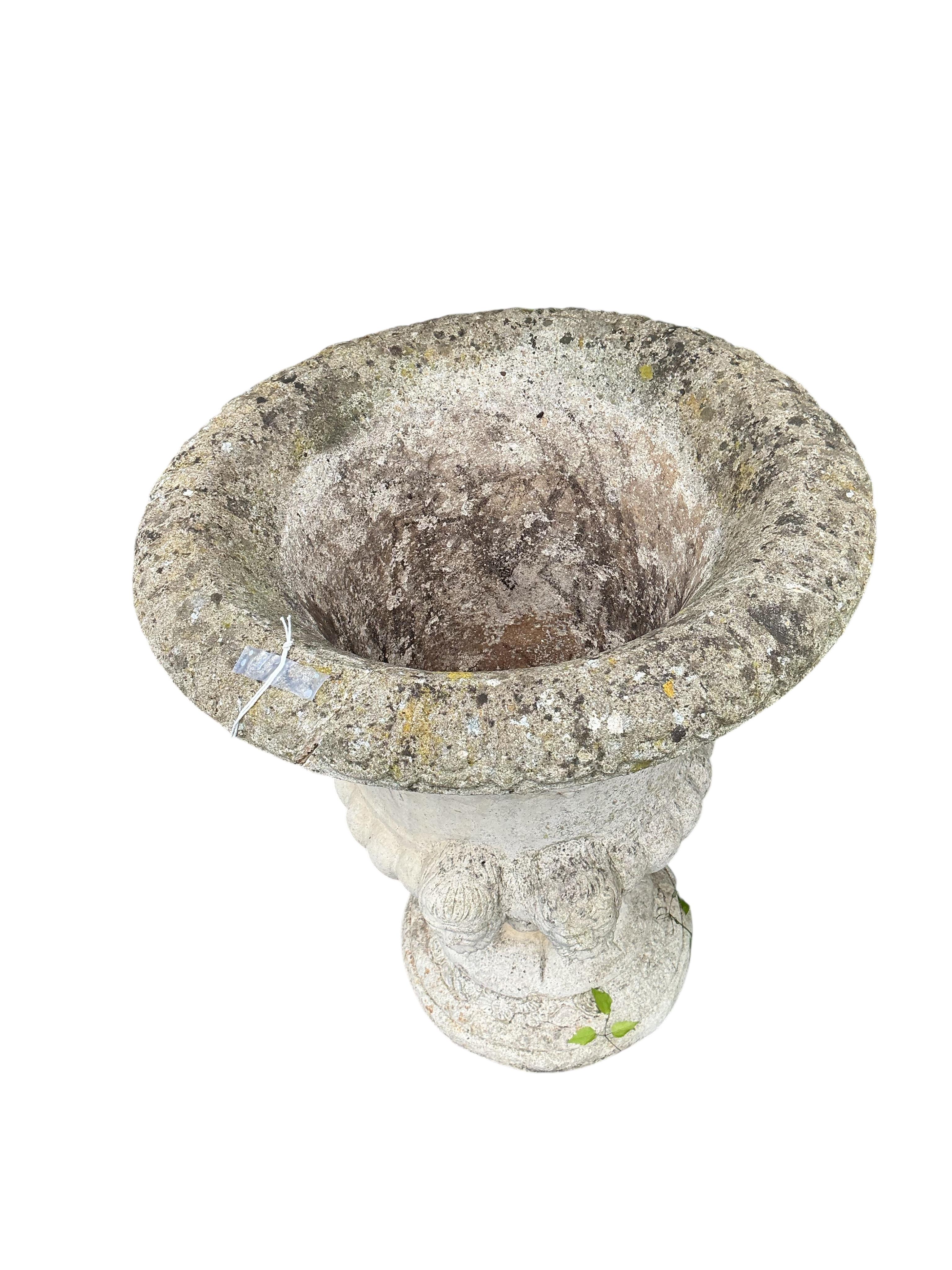 A pair of reconstituted stone campana garden urns, diameter 55cm, height 66cm